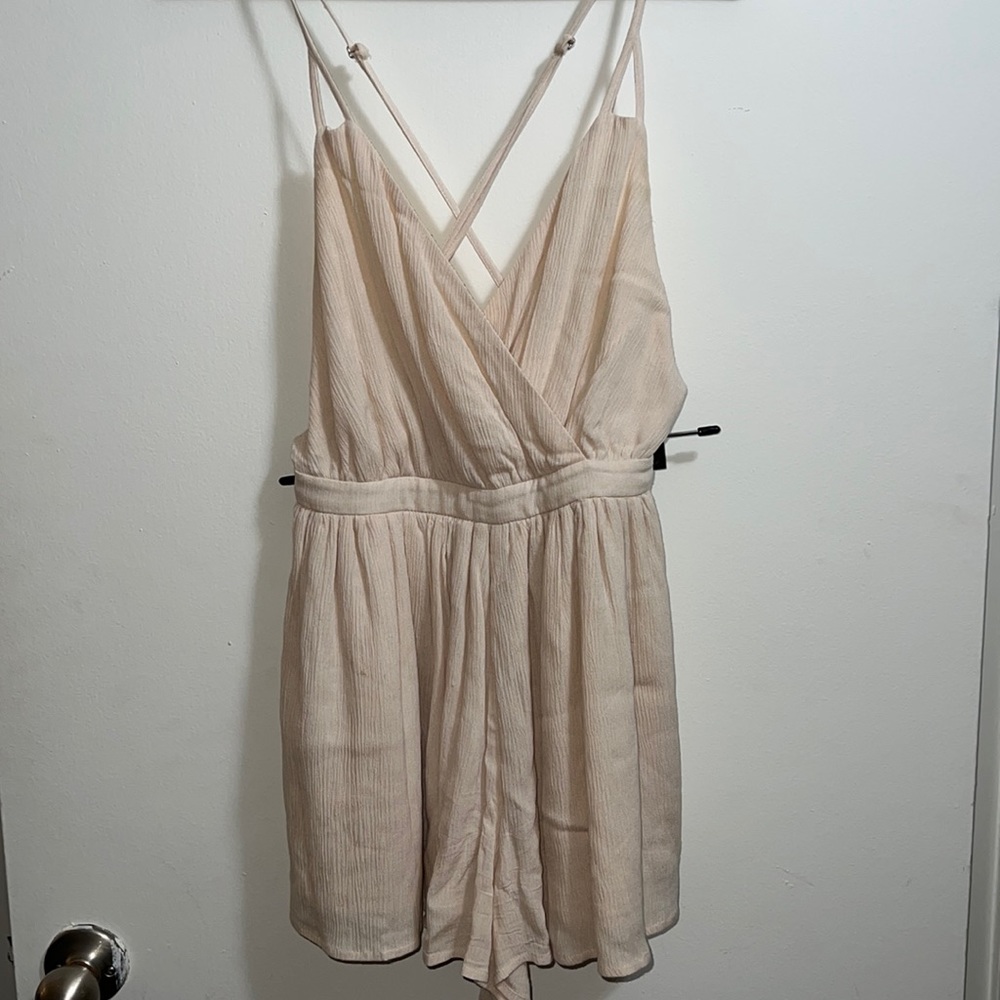 Romper. Peach/light pink color. Size small.